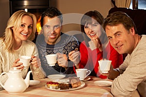 Couples Enjoying Tea And Cake Together