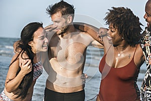 Couples enjoying together on beach