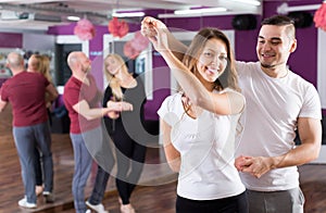 Couples having dancing class