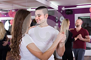 Couples having dancing class