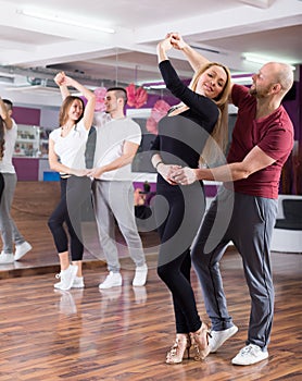 Couples having dancing class