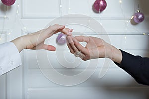 Couples holding hands.a man`s hand touches a woman`s hand