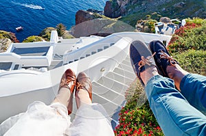 Couples legs enjoying summer day at Santorini island
