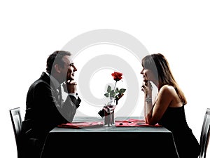 Couples lovers dating dinner silhouettes