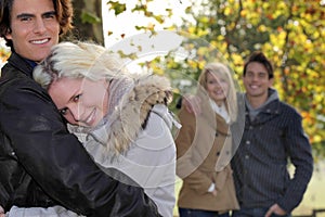 Couples strolling in the park