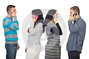 Couples talking by phone mobiles