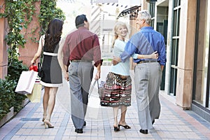 Couples Walking With Shopping Bags