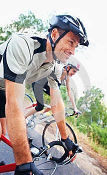 Couples who cycle together.... Shot of two people enjoying a bicycle ride together.