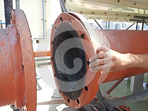 Coupling flange.The worker are holding rubber gaskets on the Rubber Expansion Joint for Cooling Tower. Close-up.