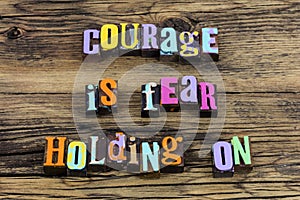 Courage is fear holding on believe challenge typography phrase