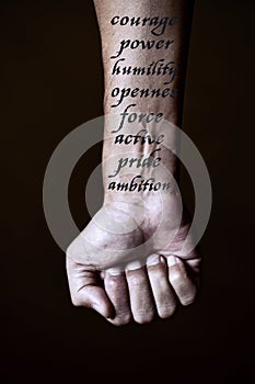 Courage, power and some other words in a forearm