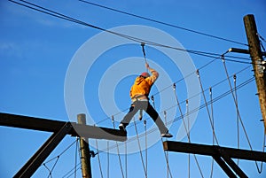 Courageous boy taking a big risky step photo