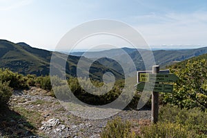 Courel mountain landscape and hiking sign with copy space photo