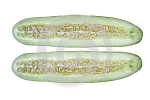 Courgette cut with planty of seeds on white background