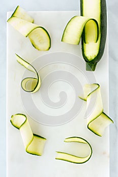 Courgette, Zucchini Ribbons and Courgette, Zucchini on Marble Board