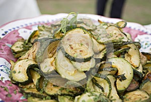 Courgette or zuchinni close up in olive oil photo