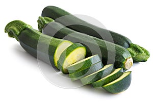 Courgettes whole and sliced isolated on white.