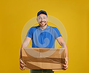 Courier with damaged cardboard box on background. Poor quality delivery service