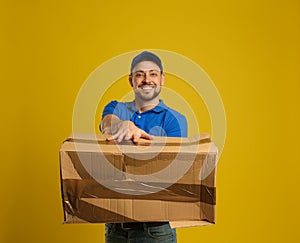 Courier with damaged cardboard box on background. Poor quality delivery service