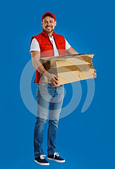 Courier with damaged cardboard box on background. Poor quality delivery service