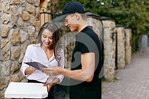 Courier Delivering Food To Client Home. Pizza Delivery