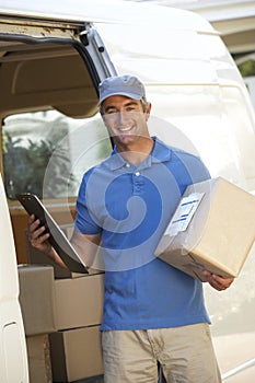 Courier Delivering Package By Van