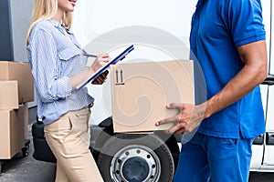 Courier delivering packages for woman