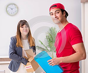 Courier delivering parcel to the office