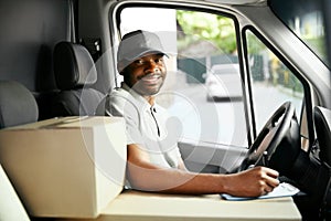 Courier Delivery. Black Man Driver Driving Delivery Car