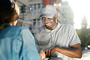 Courier Delivery Service. Man Delivering Package To Woman