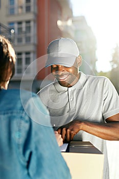 Courier Delivery Service. Man Delivering Package To Woman