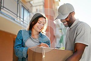 Courier Delivery Service. Man Delivering Package To Woman