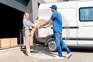 Courier giving package to woman