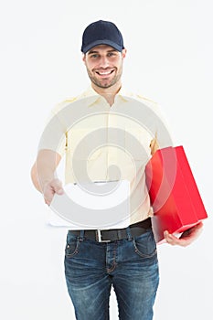 courier man with red box giving clipboard