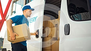 Courier Takes out Cardboard Box Package from Openned Delivery Van and Closes the Door. Delivering