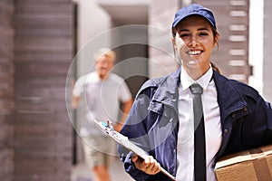 Courier woman, box and clipboard in portrait at house for customer with smile for shipping in neighborhood. Girl