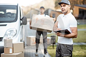 Couriers delivering parcels by car