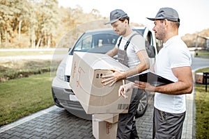 Couriers delivering parcels by car