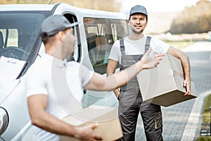 Couriers delivering parcels by car