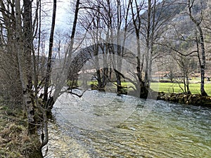 The course of the river Orbe between the cave or spring and the settlement of Vallorbe der Fluss Orbe or le fleuve de l`Orbe