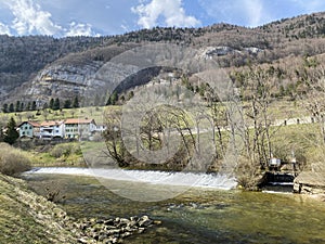 The course of the river Orbe between the cave or spring and the settlement of Vallorbe der Fluss Orbe or le fleuve de l`Orbe