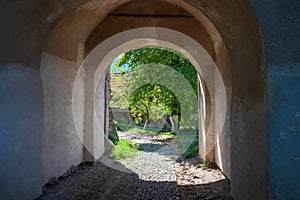 The court of fortified church in Biertan, Romania and Lutheran fortified church on background