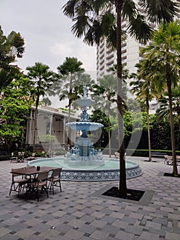 court fountain in Ruffles Hotel Singapore