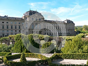 Court garden with water fontaine, stairs, hedges and geometrical beds