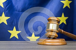 Court gavel with European Union flag in the background