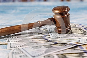 Court gavel and money on blue background