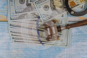 Court gavel and money on blue background