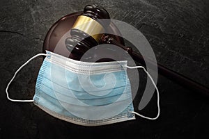 Court legal gavel and facemask -- Coronavirus mask mandate concept