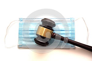 Court legal gavel and facemask isolated on white -- Coronavirus mask mandate concept