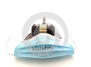Court legal gavel and facemask with Mandate text -- Coronavirus mask mandate concept